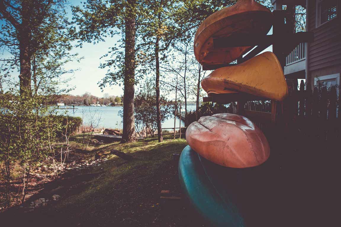 A boat rack next to a lake